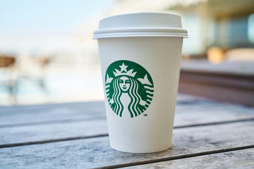 Starbucks coffee cup with logo representing branding identity.