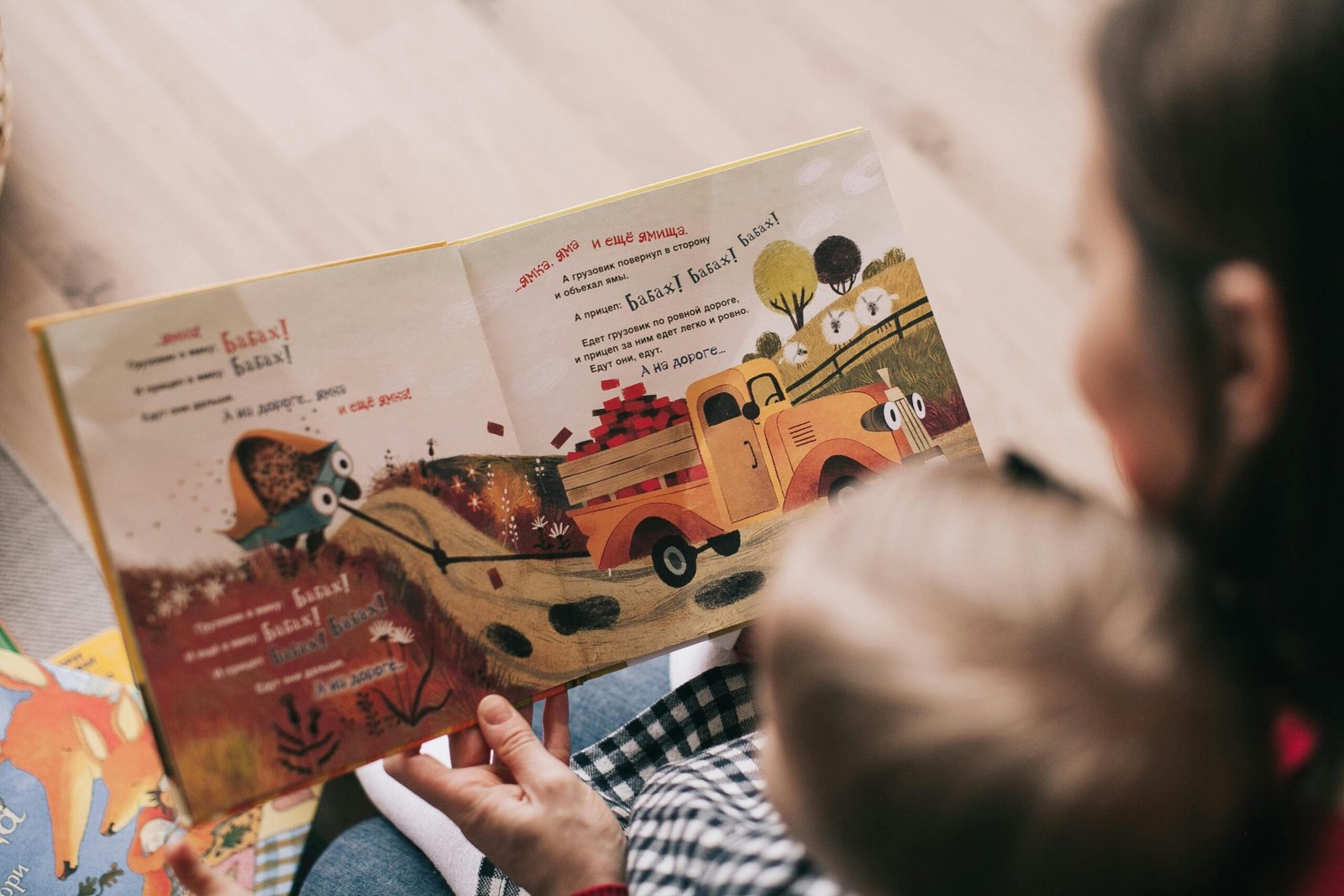 Storytelling for small businesses with a parent reading a book to a child